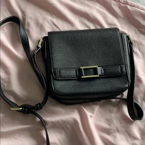 Black leather mini crossbody bag gold details